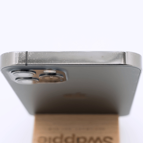 Fair condition, top edge — the top of the frame of a typical phone at this grade